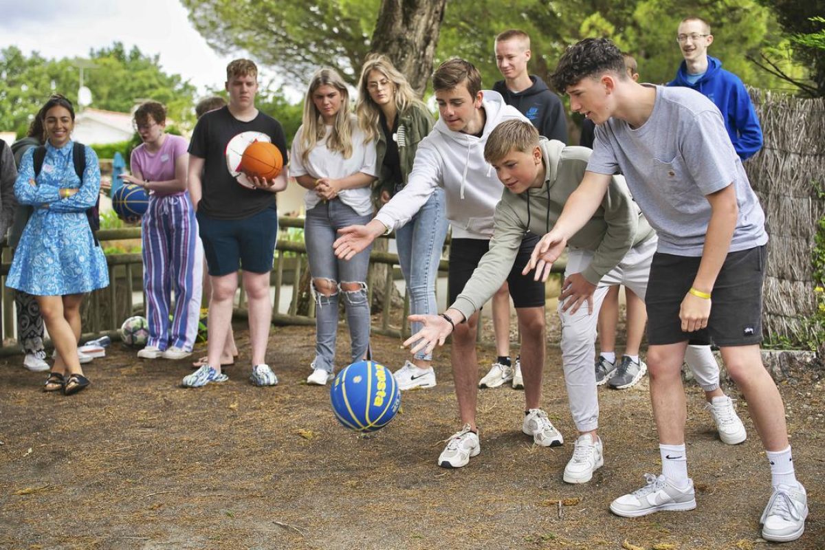 Young people bowling