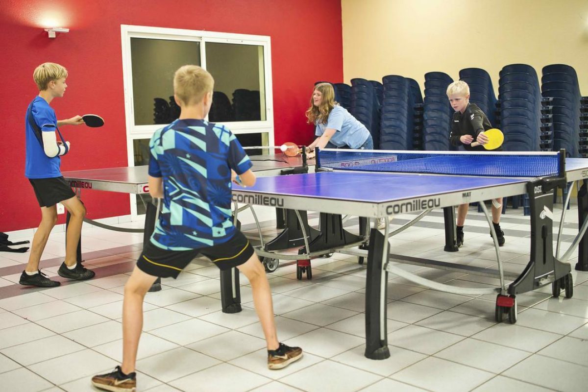 Young people playing table tennis